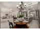 This living room/kitchen is open floor plan with modern appliances and lots of natural lighting at 2461 E Stephens Pl, Chandler, AZ 85225