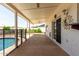 Rear covered patio overlooking lush backyard and sparkling pool at 2547 W Naranja Ave, Mesa, AZ 85202