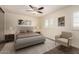 Serene bedroom featuring neutral tones, a plush bed, and a relaxing seating area at 2547 W Naranja Ave, Mesa, AZ 85202
