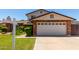 Front exterior showcasing a two-story home with a two car garage with a concrete driveway and manicured front lawn at 2547 W Naranja Ave, Mesa, AZ 85202