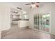 Open-concept living area showcasing tile floors, sliding door access to backyard and an eat in kitchen at 2547 W Naranja Ave, Mesa, AZ 85202