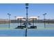 Tennis courts with shade canopies and bench seating at 2547 W Naranja Ave, Mesa, AZ 85202