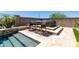 Outdoor patio with hot tub, a bar table and seating overlooking an incredible pool and lush landscaping at 26314 N 103Rd Dr, Peoria, AZ 85383