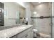 Stylish bathroom featuring granite counters, modern tile, and glass shower at 26314 N 103Rd Dr, Peoria, AZ 85383
