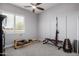 Home gym with weight-lifting machine and natural light at 26314 N 103Rd Dr, Peoria, AZ 85383