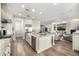 Bright and open kitchen featuring granite countertops and an island with seating at 26314 N 103Rd Dr, Peoria, AZ 85383