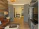 Inviting living room with hardwood floors, stylish furniture, and open doorway to adjacent spaces at 26314 N 103Rd Dr, Peoria, AZ 85383