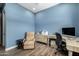 Office with a work space, comfy recliner, and lots of light at 26314 N 103Rd Dr, Peoria, AZ 85383