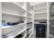 Pantry with custom shelving and lots of extra storage space at 26314 N 103Rd Dr, Peoria, AZ 85383