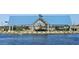 Scenic lakefront gazebo with a blue roof, offering a picturesque view of the surrounding community amenities at 2688 E Rustler Rd, San Tan Valley, AZ 85140