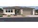 Charming single-story home featuring a two-car garage and neutral-toned stucco exterior at 2689 E Rustler Rd, San Tan Valley, AZ 85140