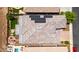 Drone eye view of beautiful home showcasing the roof, solar panels, pool, and backyard at 30287 N 115Th Dr, Peoria, AZ 85383