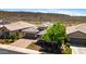 Charming single-story home featuring a brick driveway and mature landscaping, blending comfort with curb appeal at 30287 N 115Th Dr, Peoria, AZ 85383