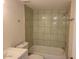 Neutral-tiled tub and shower combination, plus a single sink at 3119 W Cochise Dr # 148, Phoenix, AZ 85051