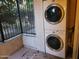 Laundry area featuring a stacked washer and dryer at 3119 W Cochise Dr # 148, Phoenix, AZ 85051