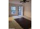 Living room with tile floors, a ceiling fan, a window and security door at 3119 W Cochise Dr # 148, Phoenix, AZ 85051