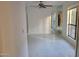 Open-concept living area with tile floors and a ceiling fan at 3119 W Cochise Dr # 148, Phoenix, AZ 85051