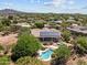 An aerial view showcases a gorgeous property featuring a backyard pool, spa and solar panels at 31234 N 47Th Pl, Cave Creek, AZ 85331
