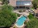 A picturesque aerial view showcasing a refreshing pool, spa, patio and solar panels at 31234 N 47Th Pl, Cave Creek, AZ 85331
