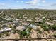 Expansive aerial view of the neighborhood with mountain views and scattered desert homes at 31234 N 47Th Pl, Cave Creek, AZ 85331