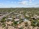 Stunning aerial view of the property with a solar panel roof and backyard pool at 31234 N 47Th Pl, Cave Creek, AZ 85331