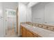 Bathroom sink with wooden cabinets, tile countertops, and large mirror at 31234 N 47Th Pl, Cave Creek, AZ 85331