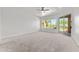 Large bedroom featuring plush carpet, a ceiling fan, and large windows to view the yard at 31234 N 47Th Pl, Cave Creek, AZ 85331