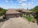 Aerial view of single-story home with tile roof, desert landscaping, and a three-car garage at 31234 N 47Th Pl, Cave Creek, AZ 85331