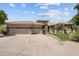 Inviting single story home with large driveway, three-car garage, and desert landscaping at 31234 N 47Th Pl, Cave Creek, AZ 85331