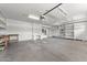 Spacious garage with ample storage, built-in shelving, and a workbench area at 31234 N 47Th Pl, Cave Creek, AZ 85331