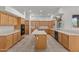 Spacious kitchen featuring an island, tile flooring, and matching wood cabinets at 31234 N 47Th Pl, Cave Creek, AZ 85331