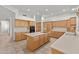 Bright kitchen featuring large island, tile flooring, and built-in appliances at 31234 N 47Th Pl, Cave Creek, AZ 85331