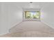 Open living room with large windows providing natural light and views of the desert landscape at 31234 N 47Th Pl, Cave Creek, AZ 85331