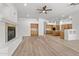 Spacious living room that opens to kitchen and island and a fireplace at 31234 N 47Th Pl, Cave Creek, AZ 85331