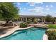 A stunning pool with stone accents surrounded by desert landscaping, adding a touch of elegance at 31234 N 47Th Pl, Cave Creek, AZ 85331