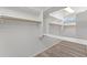 Walk-in closet featuring shelving and a hanging rod with a small window at 31234 N 47Th Pl, Cave Creek, AZ 85331