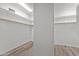 A large walk-in closet featuring plenty of shelving and hanging rods at 31234 N 47Th Pl, Cave Creek, AZ 85331