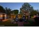 Beautiful backyard features a cozy outdoor seating area with fire pit, perfect for entertaining at 3201 E Colter St, Phoenix, AZ 85018