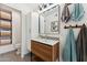 Beautiful bathroom featuring modern wood vanity, stylish mirror, and patterned tile floor at 3201 E Colter St, Phoenix, AZ 85018