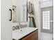 Bathroom showcasing modern wood vanity, stylish mirror, and patterned tile in the shower at 3201 E Colter St, Phoenix, AZ 85018