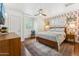 Cozy bedroom featuring designer wallpaper, ceiling fan, and a comfortable rug at 3201 E Colter St, Phoenix, AZ 85018