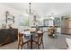Charming dining area adjacent to a well-equipped kitchen with stylish tile floors at 3201 E Colter St, Phoenix, AZ 85018