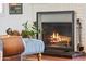 Close-up of a warm fireplace with brick surround and decorative accents at 3201 E Colter St, Phoenix, AZ 85018