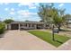 Inviting home exterior featuring a well-kept lawn, convenient driveway, and charming mailbox at 3201 E Colter St, Phoenix, AZ 85018