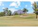 Scenic golf course view of the putting green, with a mountain in the background at 3201 E Colter St, Phoenix, AZ 85018