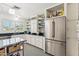Bright kitchen featuring white cabinetry, stainless steel appliances, and unique tile flooring at 3201 E Colter St, Phoenix, AZ 85018
