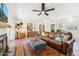 Spacious living room with hardwood floors, cozy seating, and an open layout at 3201 E Colter St, Phoenix, AZ 85018