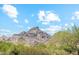 Scenic view of rugged mountain peaks against a blue sky with scattered clouds at 3201 E Colter St, Phoenix, AZ 85018