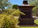 Close up of the outdoor fireplace with brick pavers around it at 3201 E Colter St, Phoenix, AZ 85018