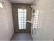 Modern shower featuring glass-block window and sleek white tile at 3201 E Colter St, Phoenix, AZ 85018
